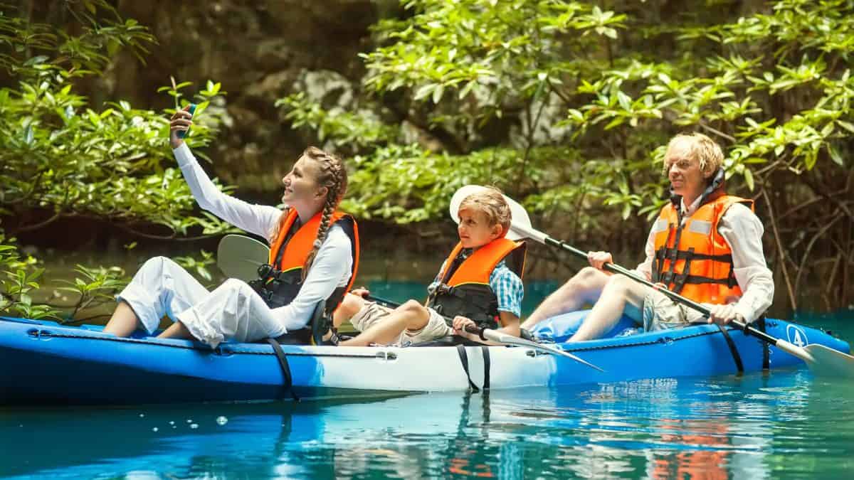 family in a 3 person kayak