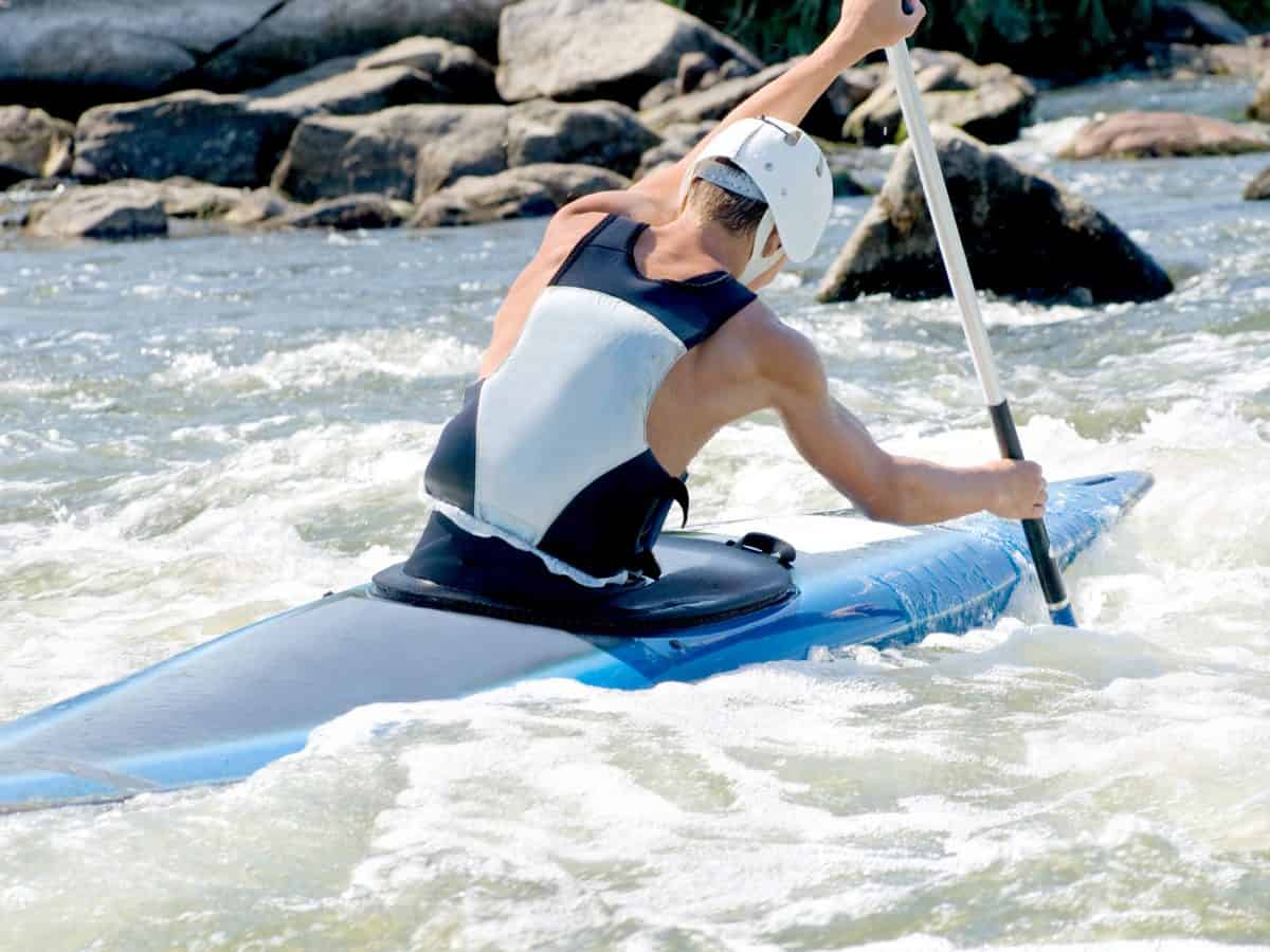 an active kayaker on the rough water
