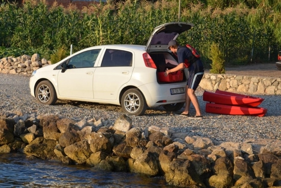 Avid Kayak storing Point 65 Falcon in the truck of his car