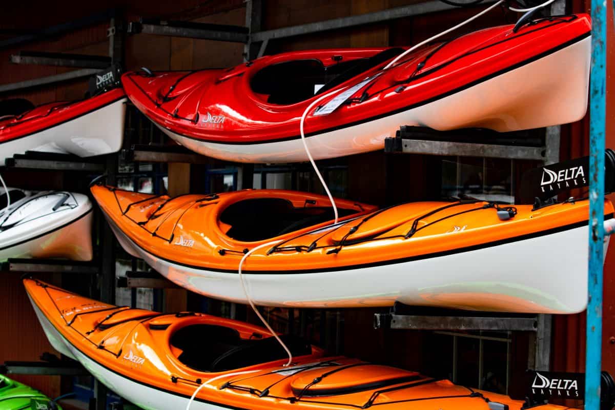 small lightweight recreational kayaks stored on a kayak rack