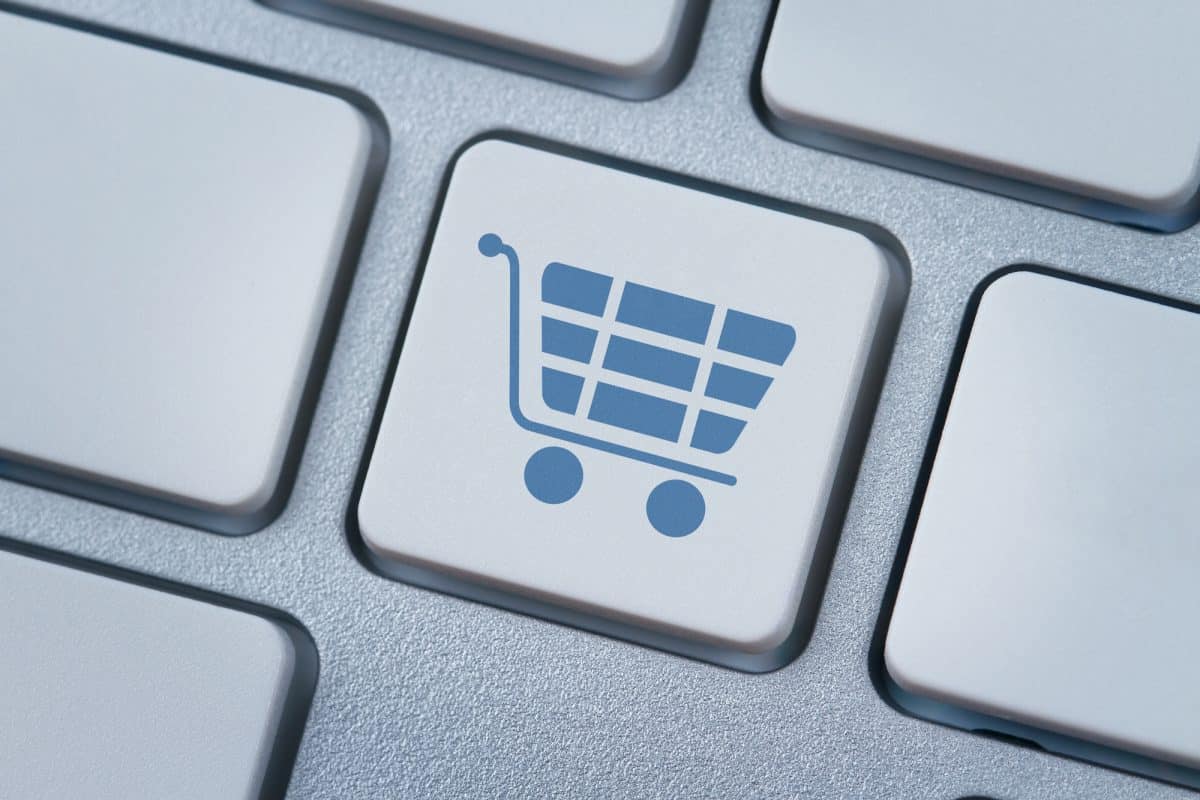 Buying kayaks online - Shopping cart symbol at the computer key
