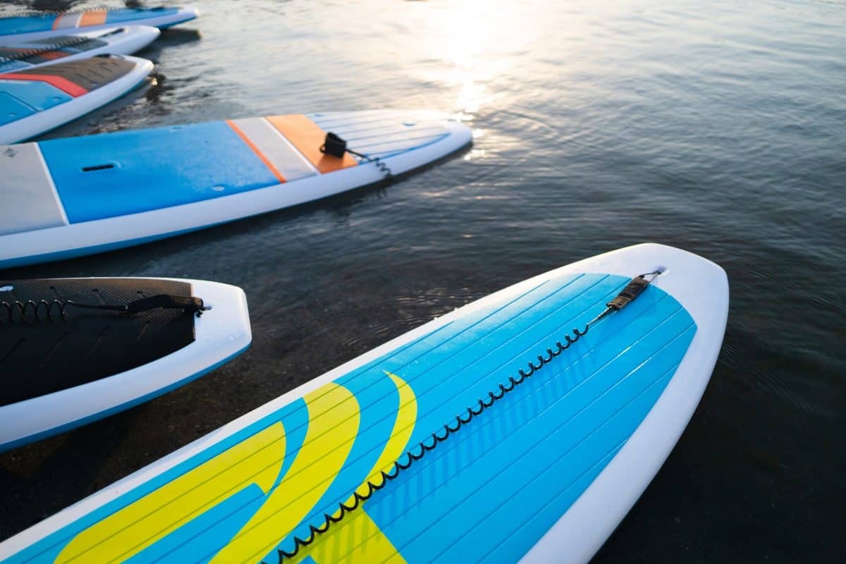 Close up of stand up SUP paddle board on lake