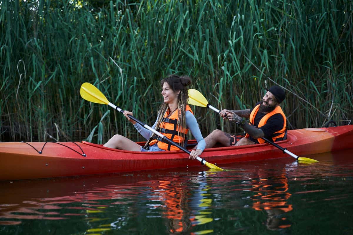 Couple in a Red Hired Double Kayak