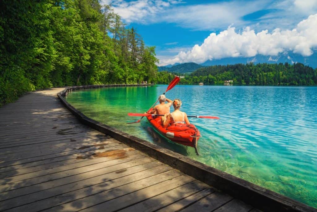Couple kayaking in very shallow water