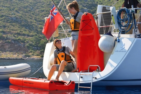 Couple loading the Point 65 Falcon from a boat
