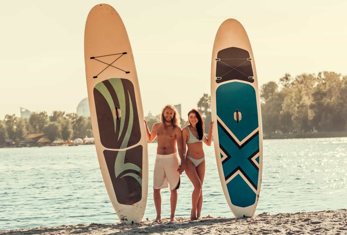 Couple stand up paddleboarding