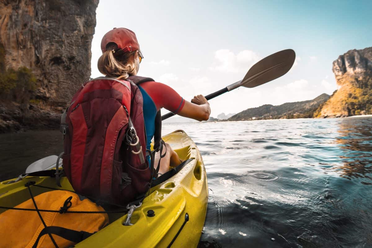 Lady paddling the best Cheap kayak, the pelican maxim 100x