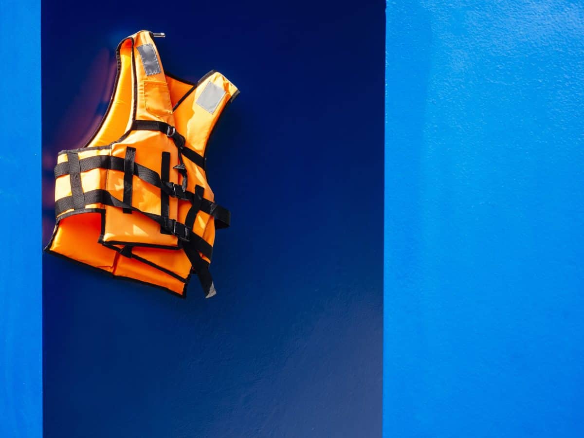 Life Vest hanging on blue wall