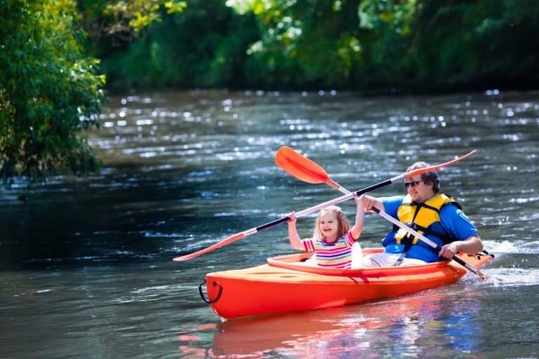 Large man in kayak with child