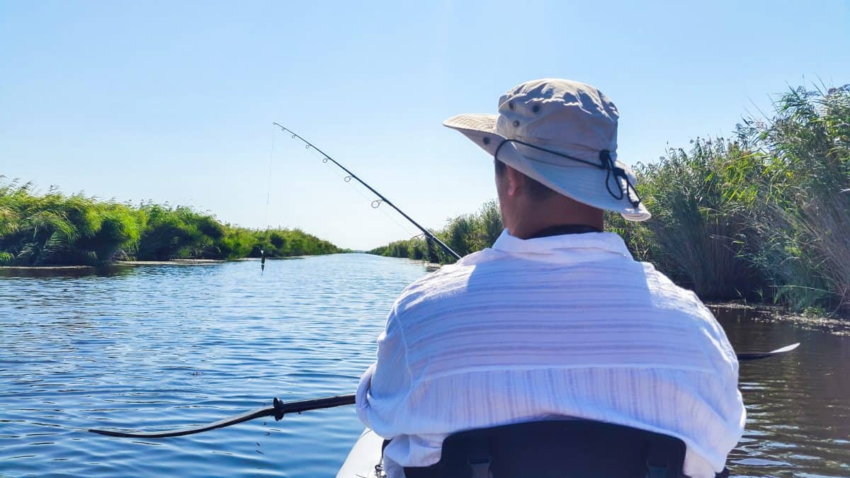 Man in tandem fishing kayak 