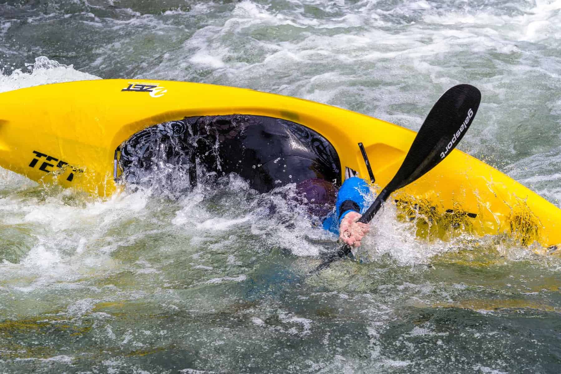 Kayaker demonstrating the Roll the C to C