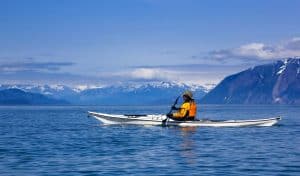 Female sea kayaker paddling in Glacier