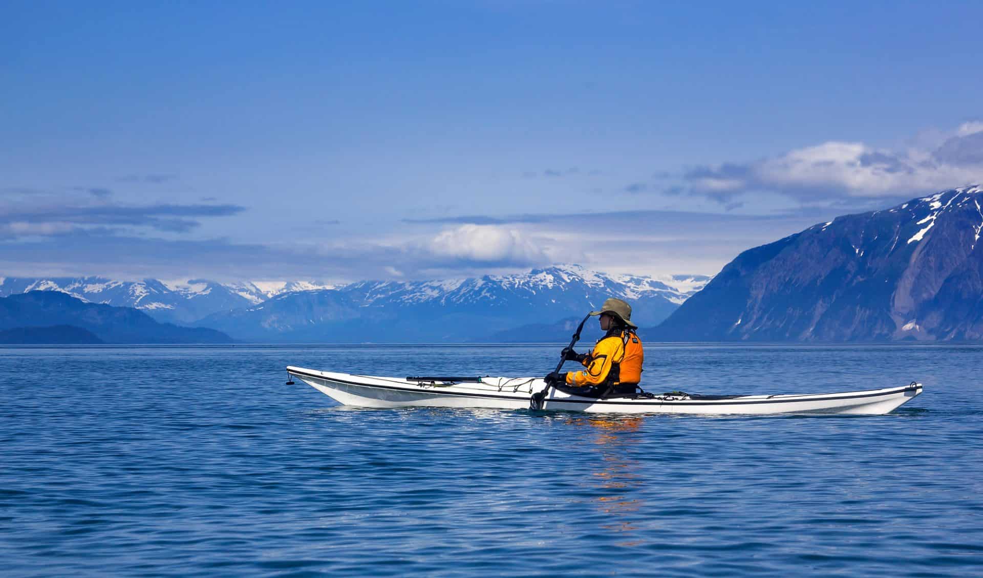 Female sea kayaker paddling in Glacier