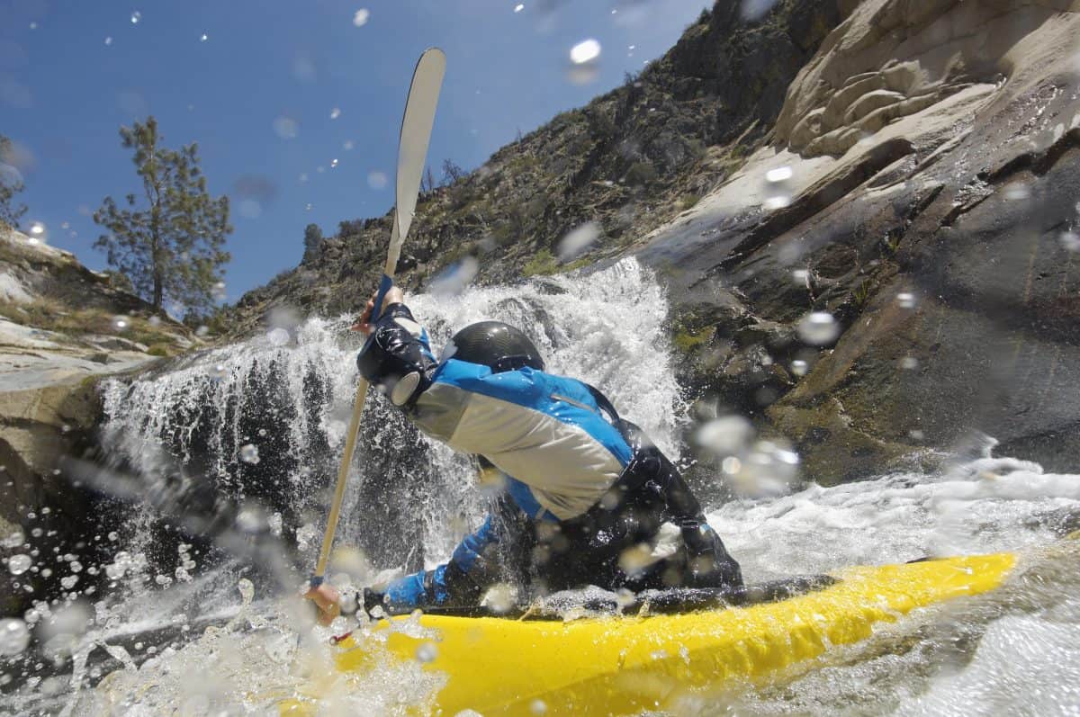 kayaker in yellow recreational kayak for rivers