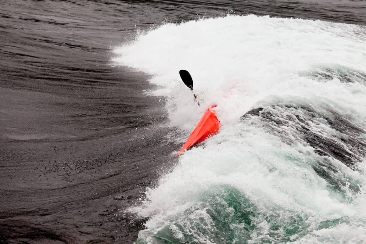 hazards of kayaking - waves overcome kayaker 