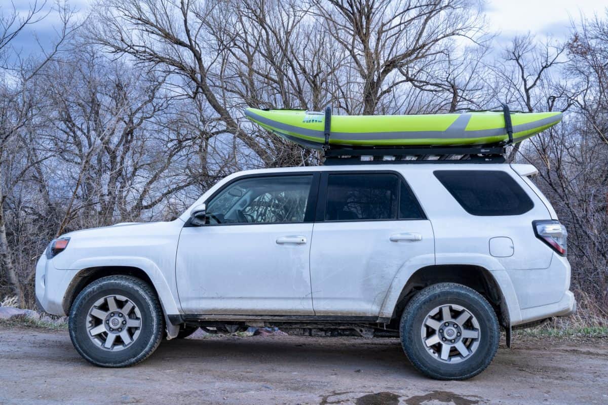 oyota 4runner and whitewater inflatable kayak on roof rack