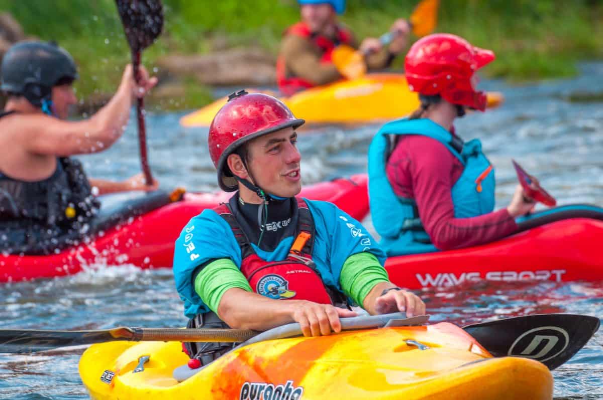 group of guys sitting in the sun dolphin aruba sit on top kayaks