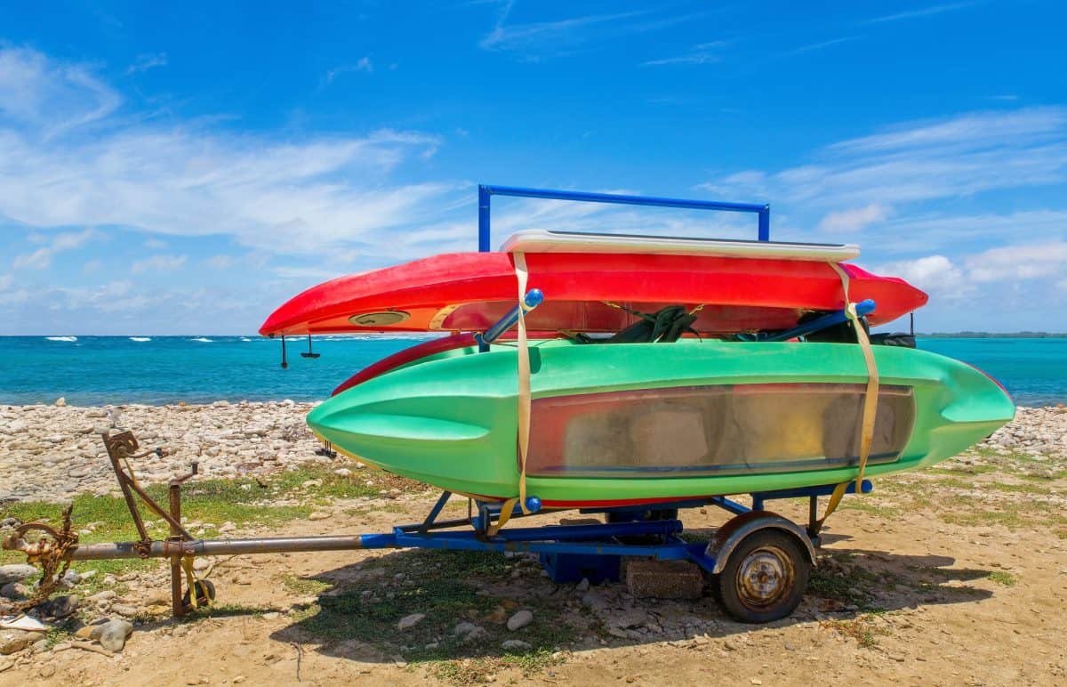 Trailer with canoes on beach