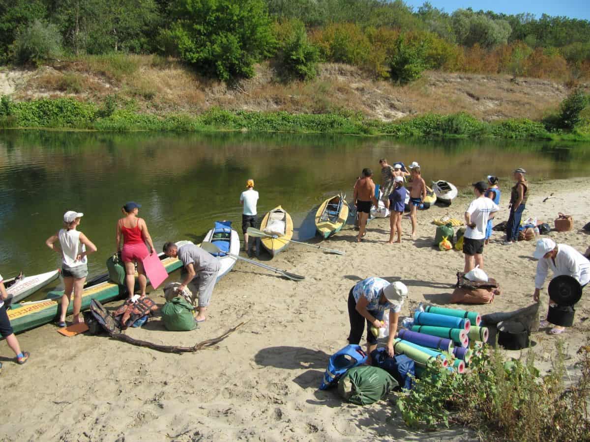 group big guys and big guys preparing for kayaking trip