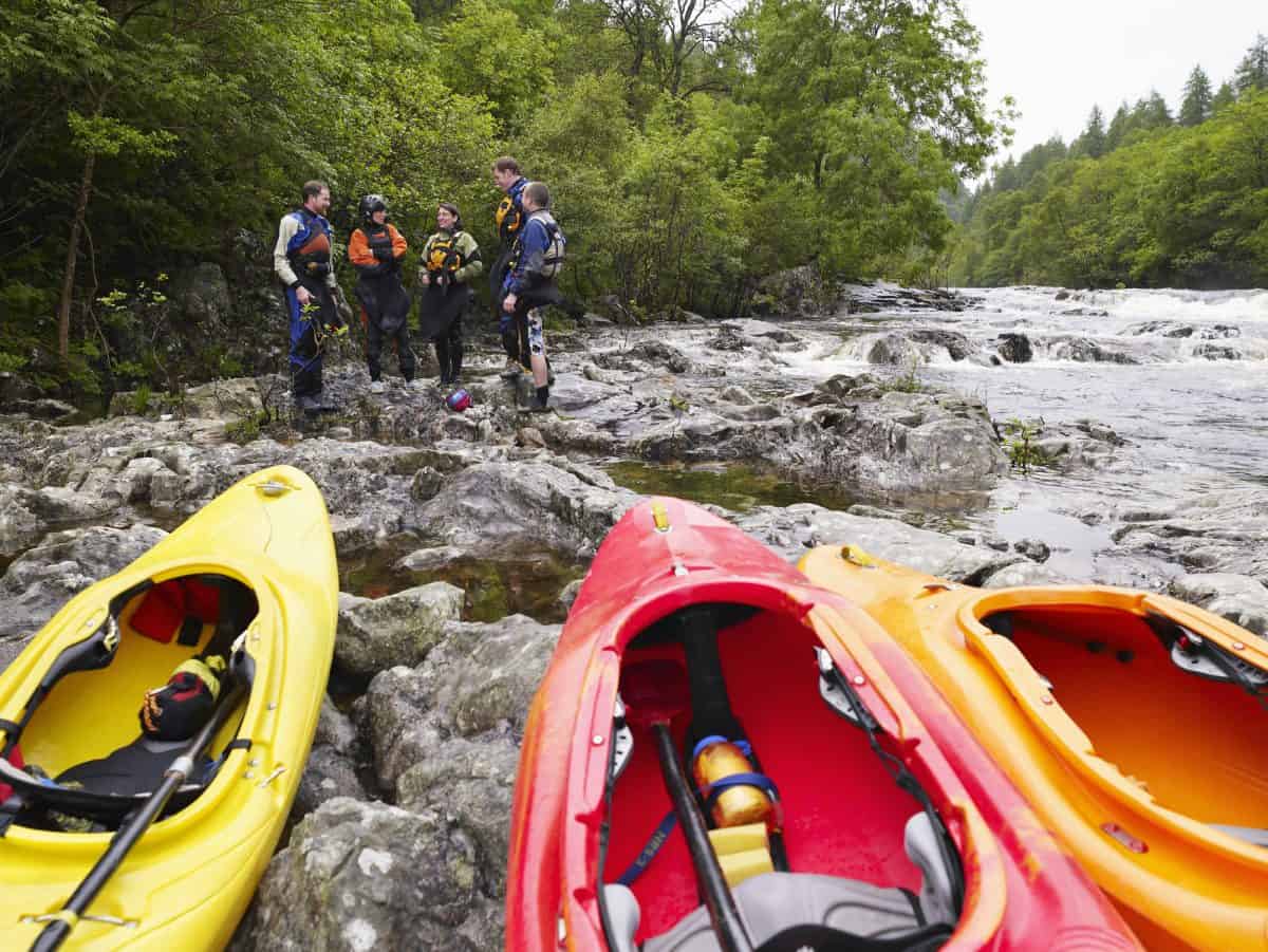Group of 3 best river kayaks on the river bank