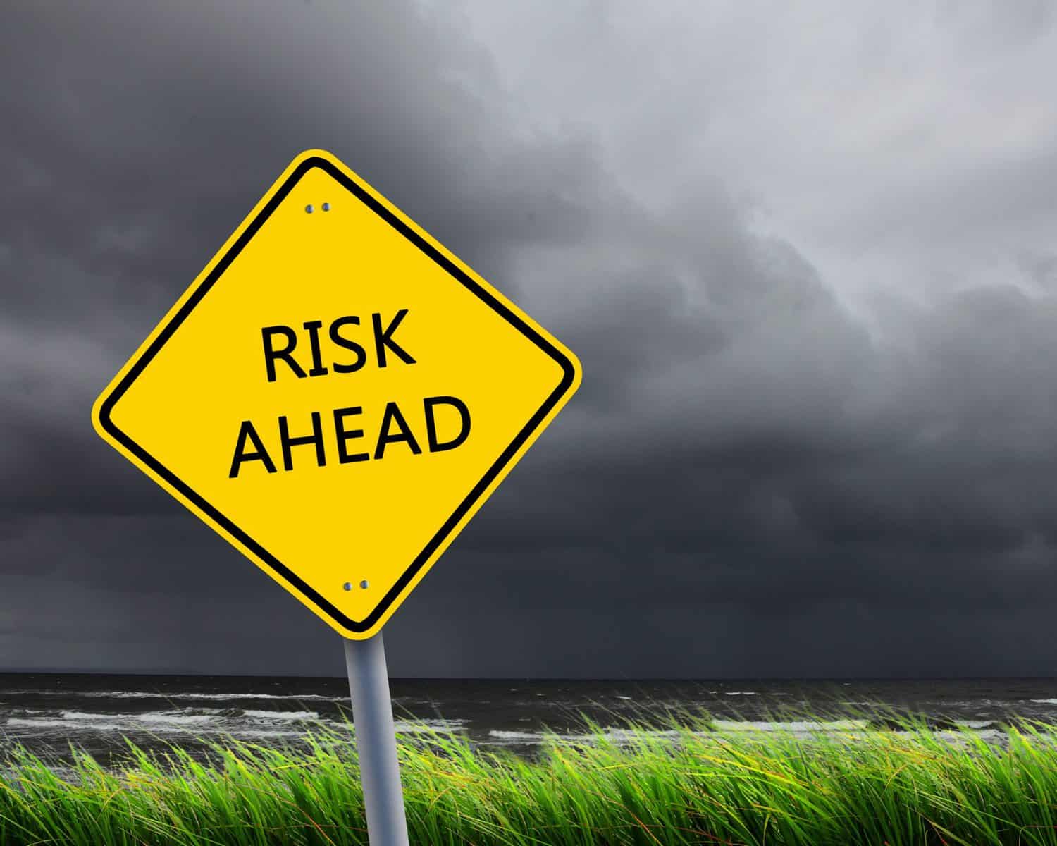 risks of kayaking yellow sign warning of danger