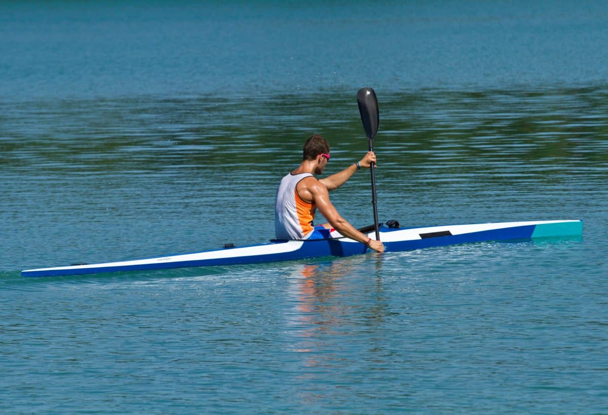 Young athlete in a racing kayak