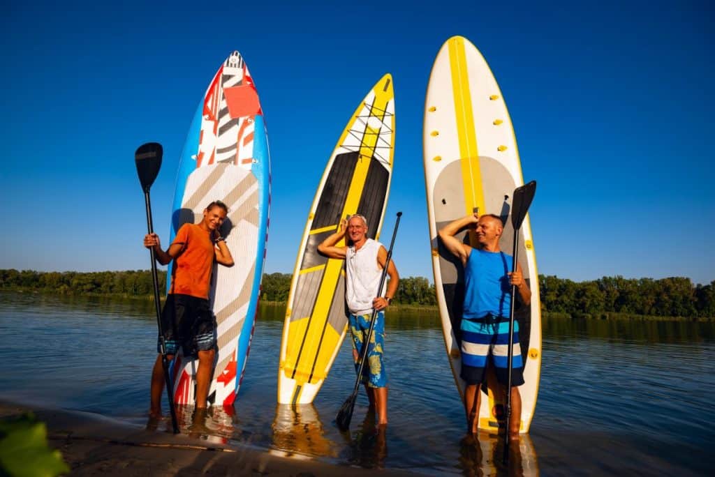 Happy friends with SUP boards