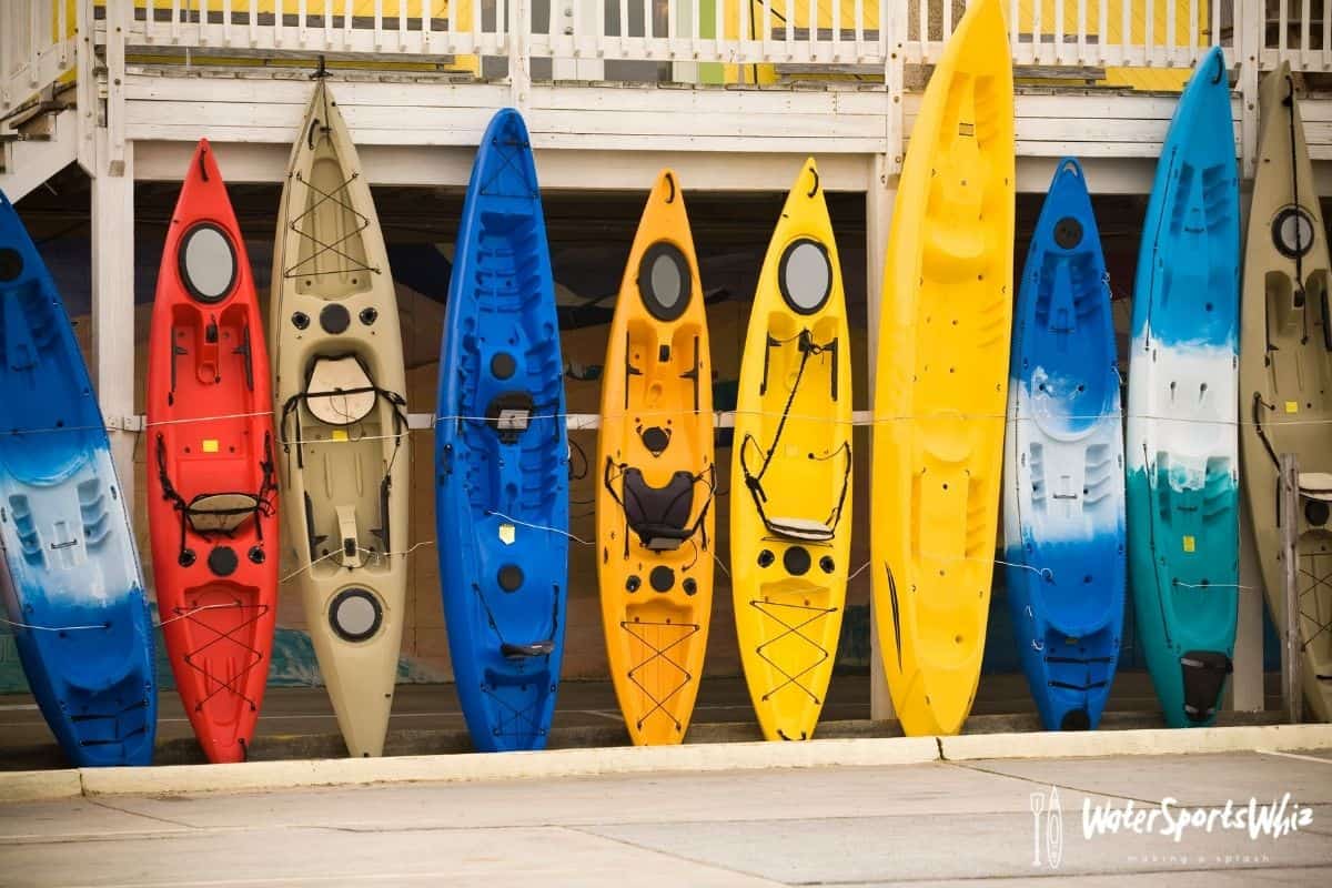 Various kayaks lined up for sale