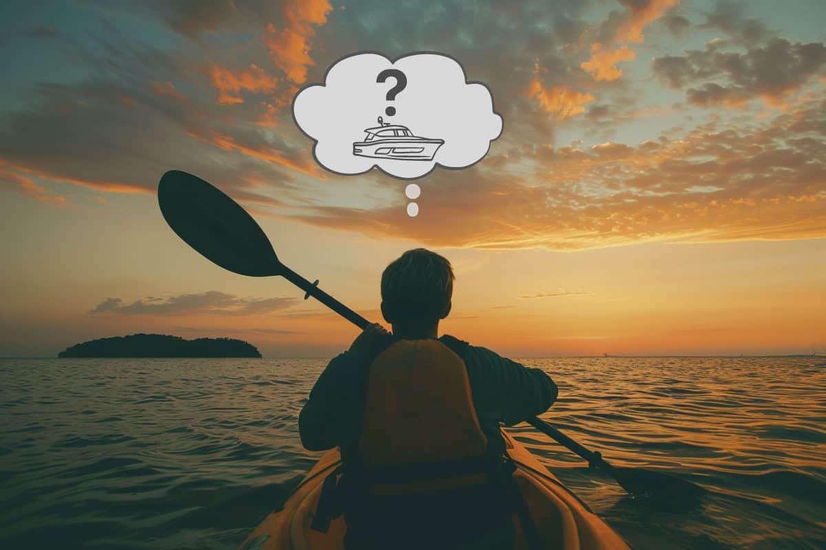 Man paddling kayak with thought bubble with boat and question mark