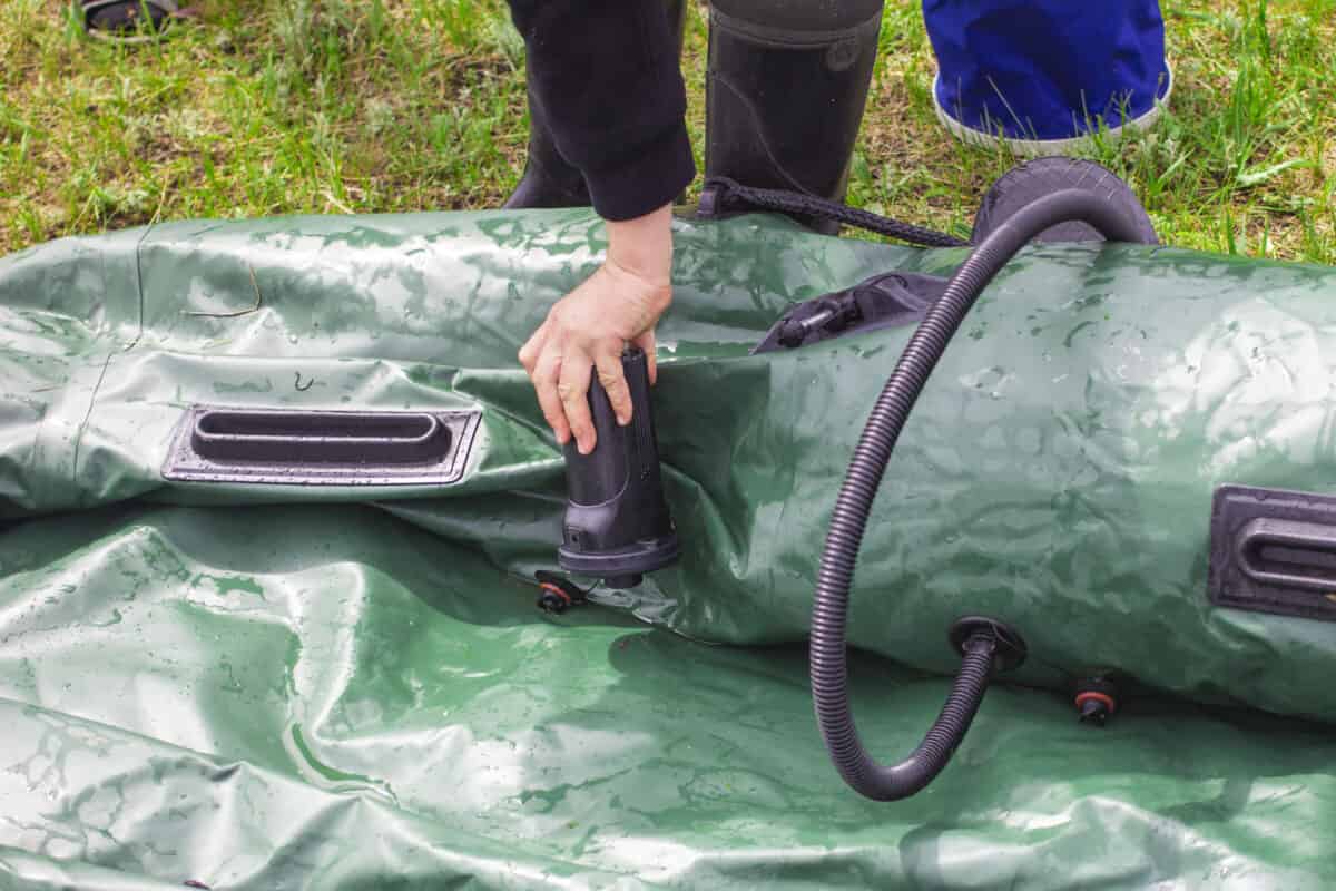 Man Patching an Inflatable Kayak