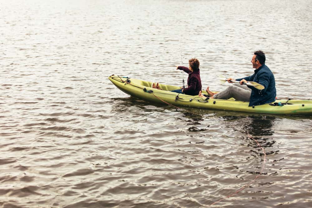 Father and son anchored in kayak