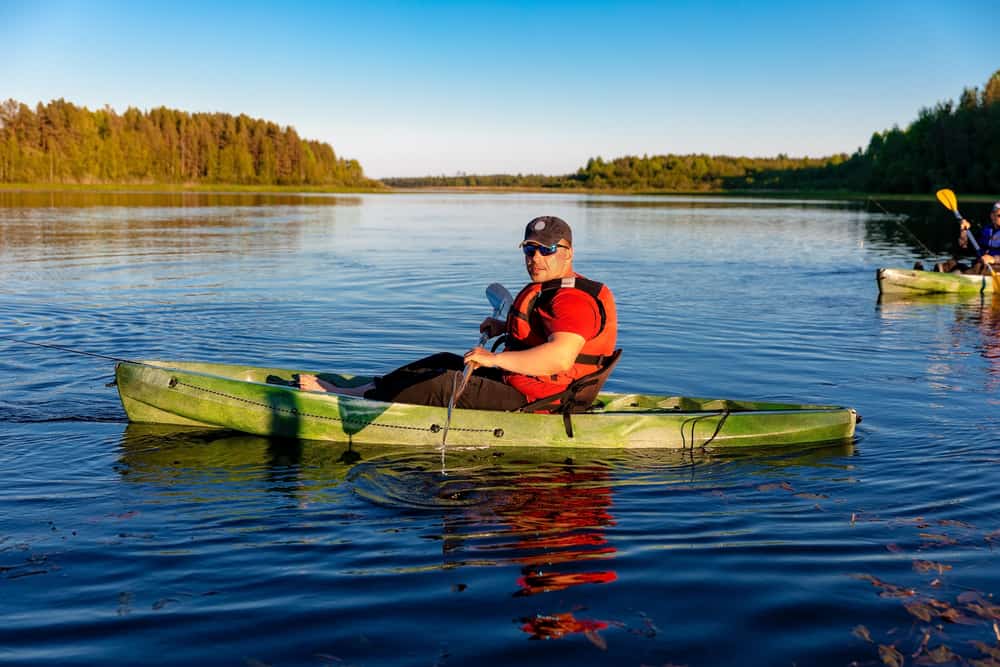 Man in Green Kayak with Anchor trolley