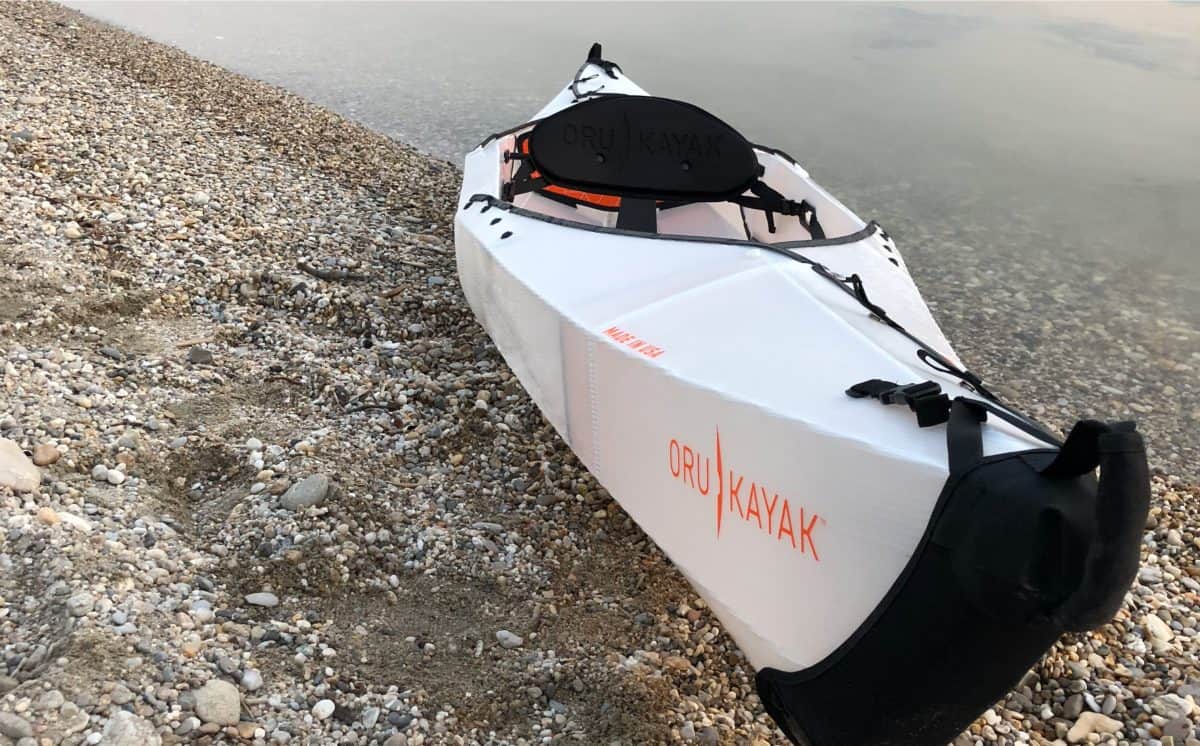 Oru Kayak - origami kayak on river bank