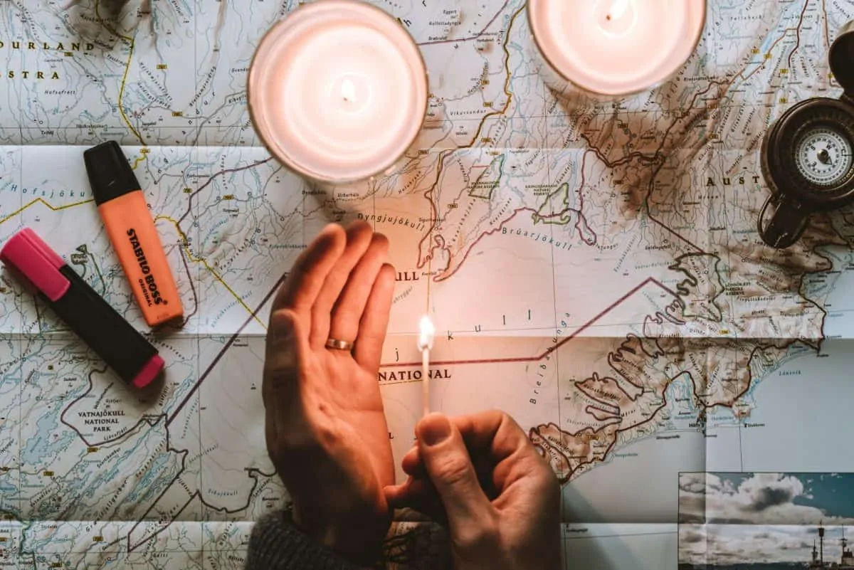 Man planning his trip using a large scale map