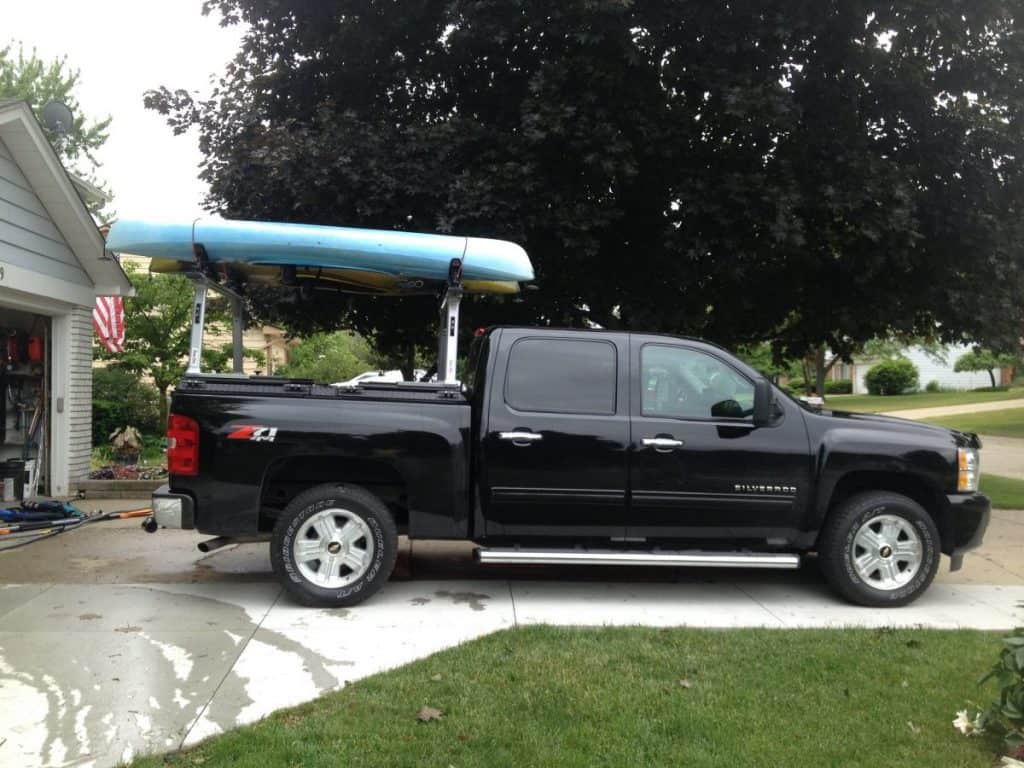Blue kayak on truck bed rack
