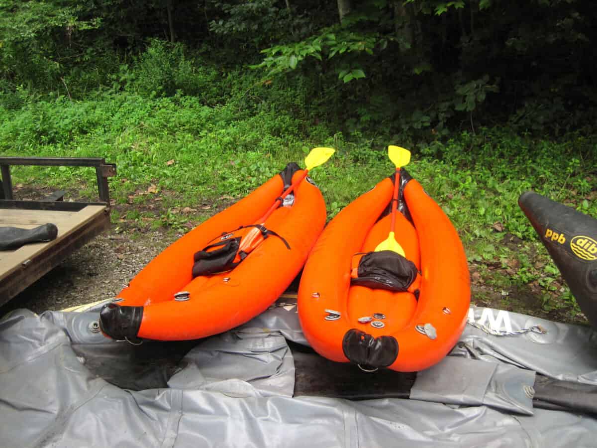 Two bright orange fully inflate kayaks