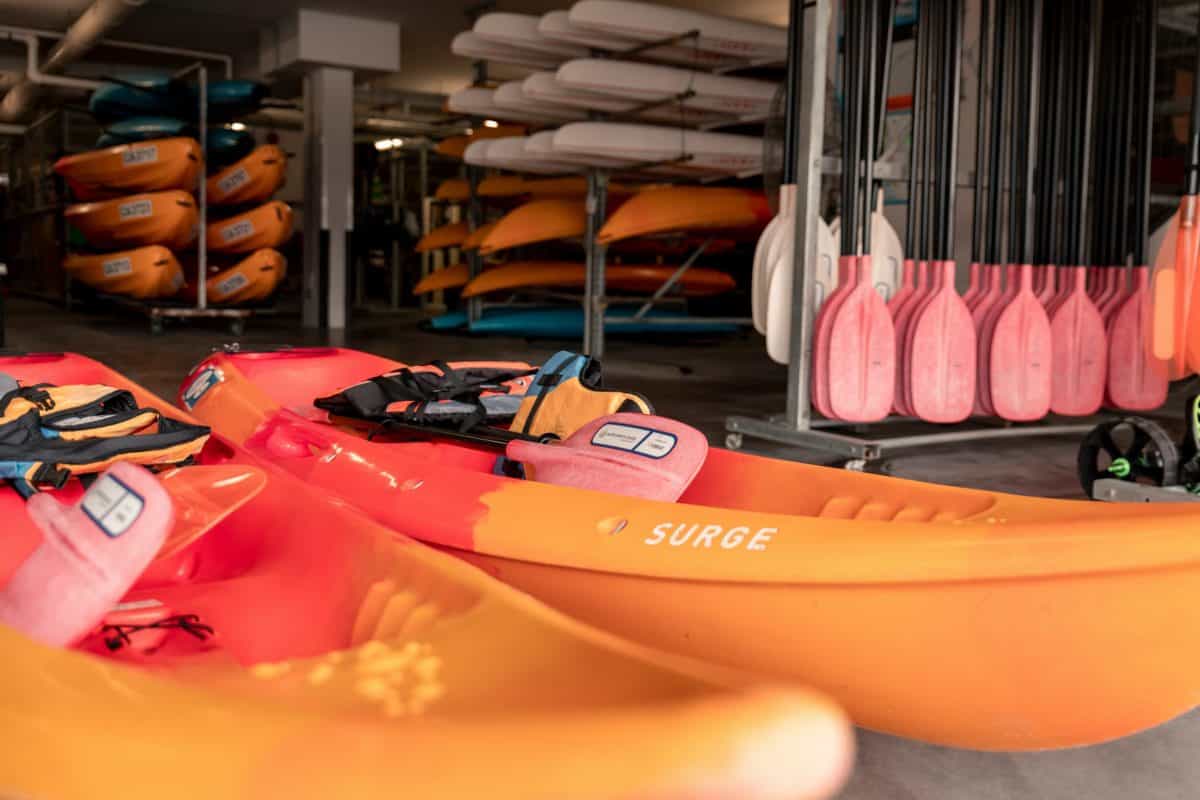 Orange sit on top kayak in store