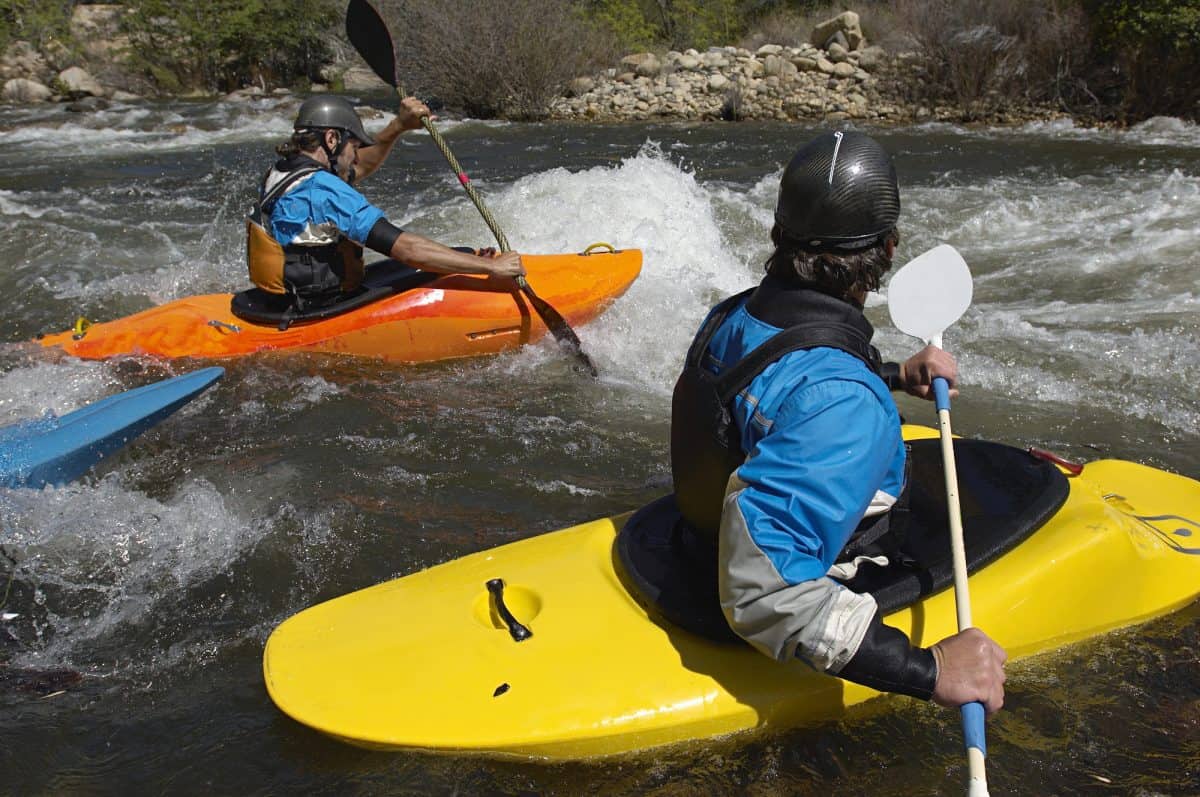Whitewater Kayakers On River