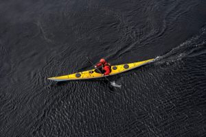 Yellow sea kayak on open water