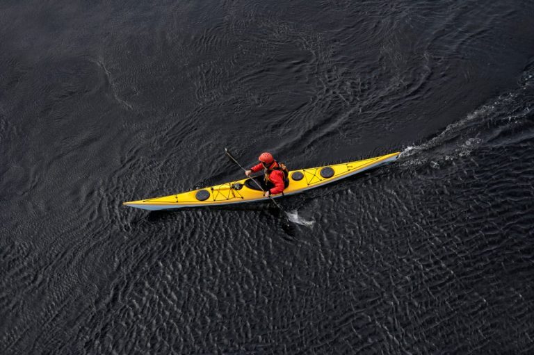 Yellow sea kayak on open water