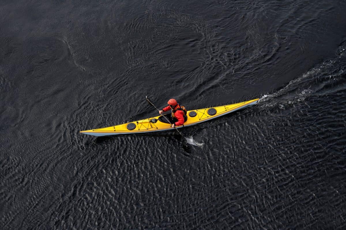 Yellow sea kayak on open water