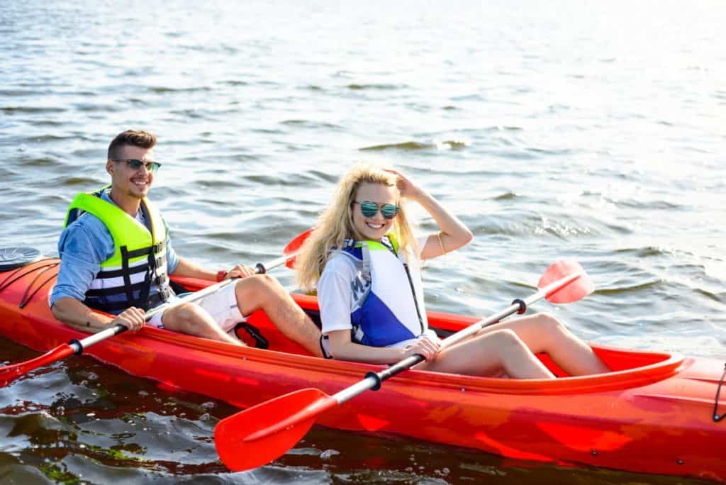 Young Couple experiencing their first time in a kayak