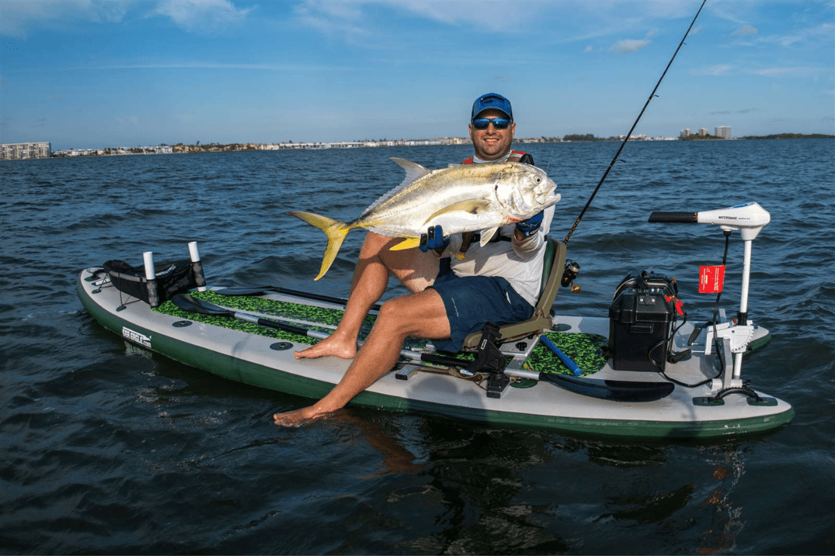 Man fishing from a Paddle board crossover